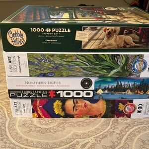 4 puzzles. 1000 pieces each. EUC.